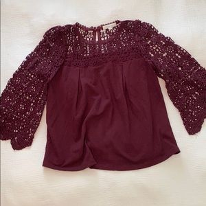 Garnet colored, bell sleeve knit top